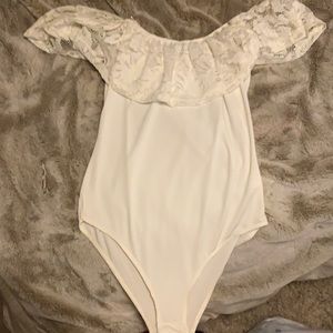 white strapless bodysuit with a lace layover